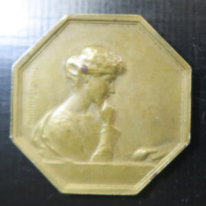 France medal jeton, La lectrice woman reading brass hexagonal by Rasumny early 20th c.