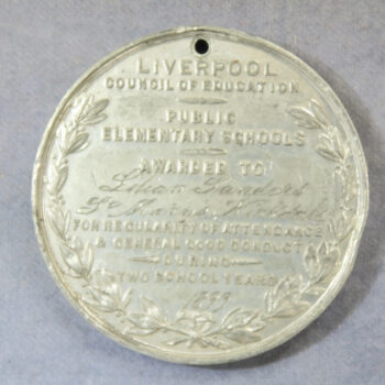 Liverpool Council of Education pewter 2 year attendance medal by J Moore awarded 1899 to Lilian Sanders, St. Mary's Kirkdale Elementry School - ploughman