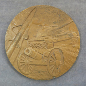 Rocket missiles and old tank on bronze medal
