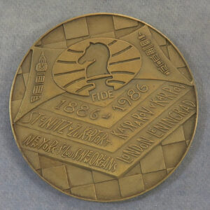 chess board medal and text 1886 1986 FIDE