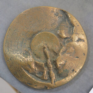 Abstract bronze medal with disc centre