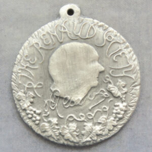 The Renaud Society logo and vine leaves with grapes. White metal medal RD189